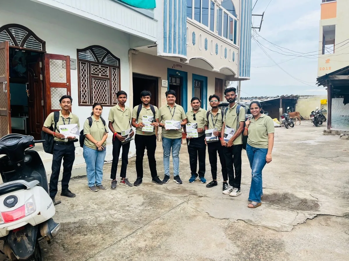 r-solar field sales team door-to-door in a village street