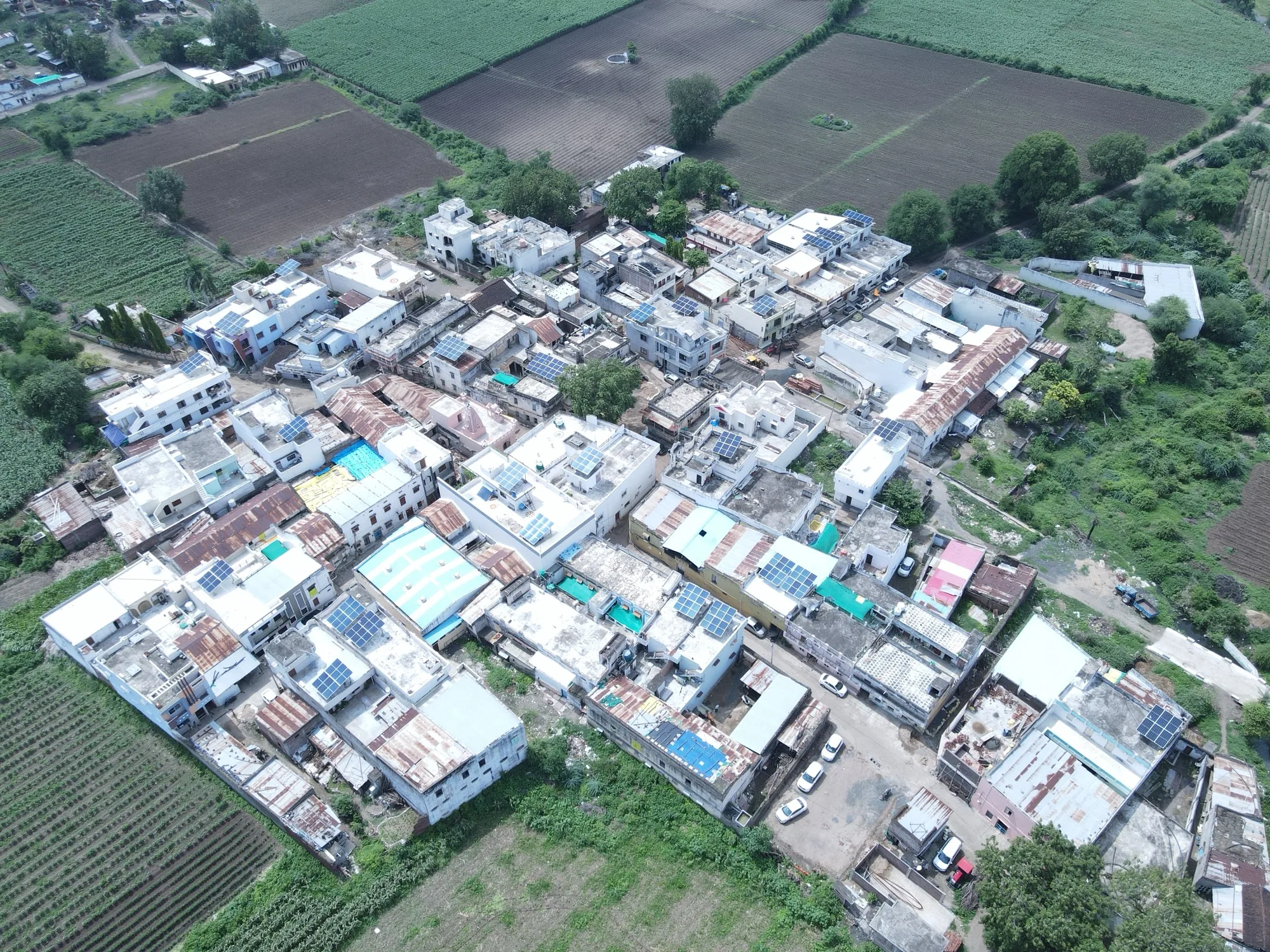 Aerial view of Piplaj village showing multiple r-solar rooftop installations